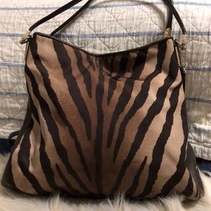 Coach purse with  and brown leather.